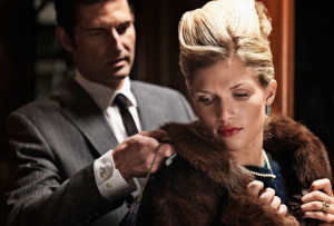 man_helping_with_coat